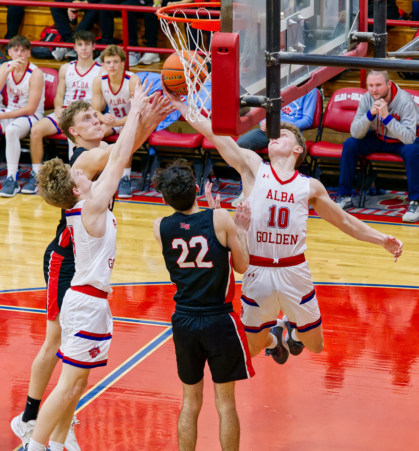 Cameron Lennon and Gaven Parker fight for the rebound against North Hopkins.